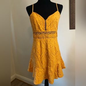 Fashion Nova mini dress mustard color. Ruffle trim. Has lining spaghetti straps.